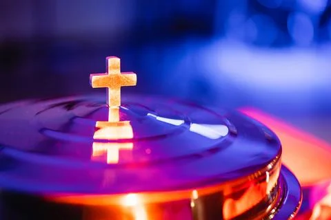 The process of breaking bread in the modern church. Stock Photos