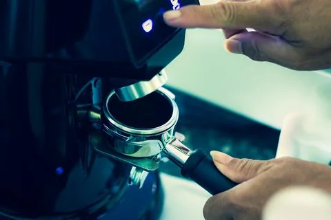 Process of brew coffee making in a coffee house.The barista hand grinding f.. Stock Photos