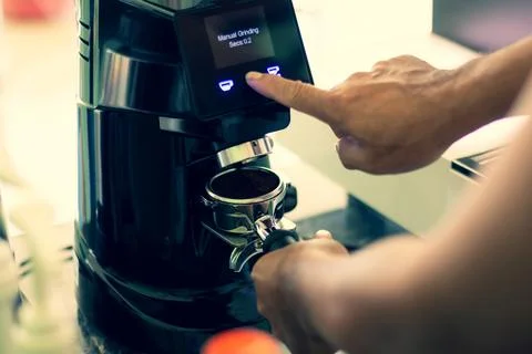 Process of brew coffee making in a coffee house.The barista hand grinding f.. Stock Photos