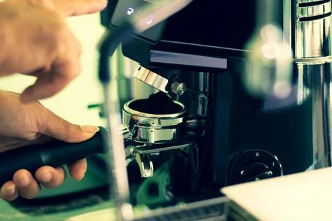 Process of brew coffee making in a coffee house.The barista hand grinding f.. Stock Photos