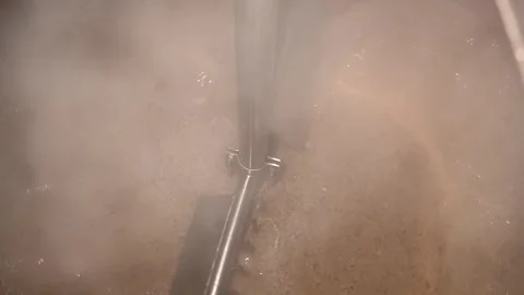 Process of Brewing Beer at a Private Craft Brewery in Slow Motion With Malt and Stock Footage 323917988