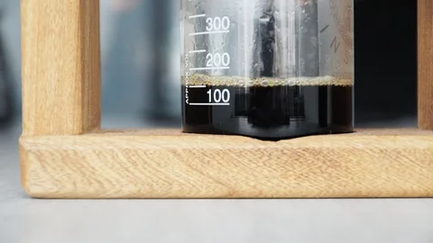 The process of brewing coffee by infusion. The liquid beverage dripping Stock Footage 104837086