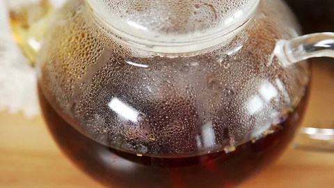 The process of brewing herbal tea in a glass transparent teapot, Video stock 79525212
