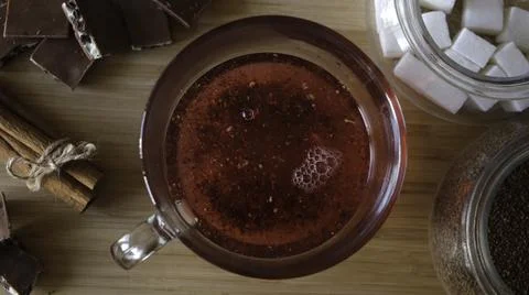 Process of brewing red karkade tea, close up top view. Concept. Cup of freshly Stock Photos
