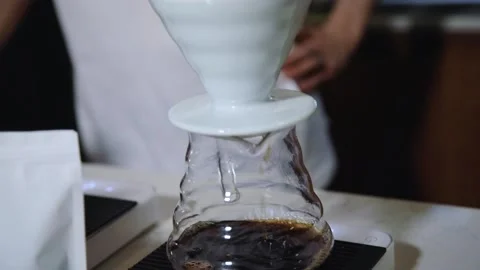 The process of brewing specialty coffee. Brewing coffee in a funnel. Stock Footage 164151664