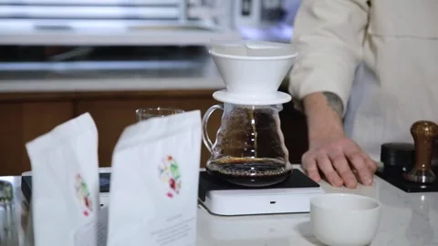 The process of brewing specialty coffee. Brewing coffee in a funnel. Stock Footage 164151678