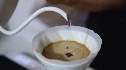 The process of brewing specialty coffee. Brewing coffee in a funnel. Stock Footage 164151697
