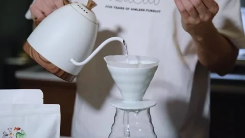 The process of brewing specialty coffee. Brewing coffee in a funnel. Stock Footage 164151721