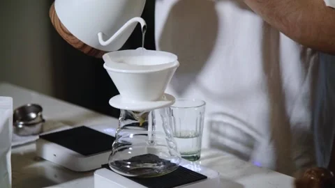 The process of brewing specialty coffee. Brewing coffee in a funnel. Stock Footage 164151769