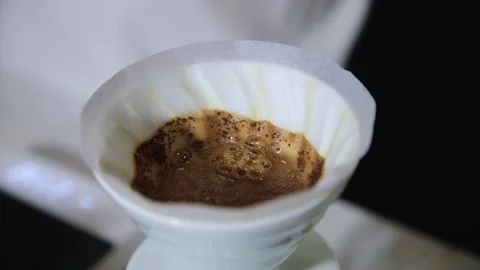 The process of brewing specialty coffee. Brewing coffee in a funnel. Stock Footage 164151770
