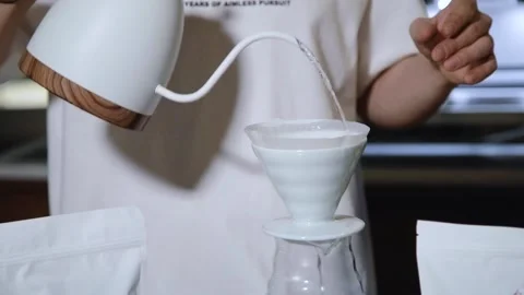 The process of brewing specialty coffee. Brewing coffee in a funnel. Stock Footage 164151783