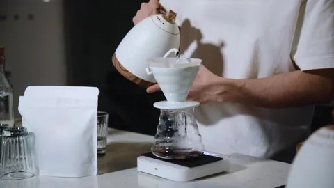 The process of brewing specialty coffee. Brewing coffee in a funnel. Stock Footage 164151794