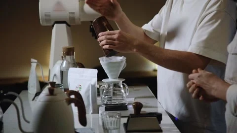 The process of brewing specialty coffee. Brewing coffee in a funnel. Stock Footage 164151807