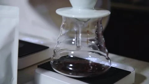 The process of brewing specialty coffee. Brewing coffee in a funnel. Stock Footage 164151817
