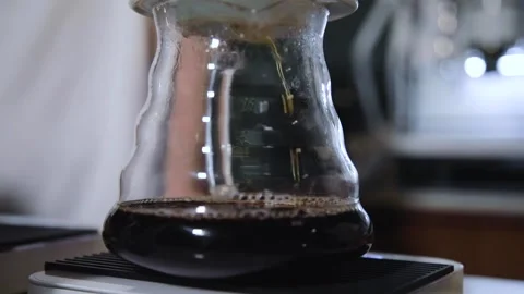 The process of brewing specialty coffee. Brewing coffee in a funnel. Stock Footage 164151859