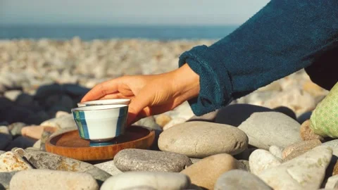 The process of brewing tea. Chinese ceremony on a pebble beach. Stock Footage 168527255