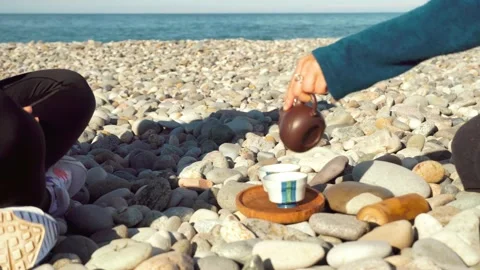 The process of brewing tea. Chinese ceremony on a pebble beach. Stock Footage 168527545