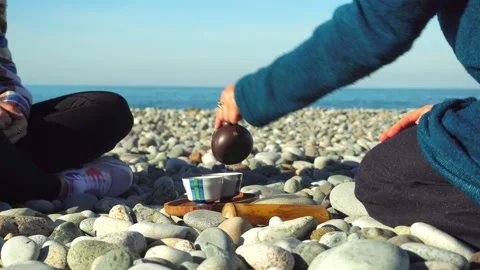 The process of brewing tea. Chinese ceremony on a pebble beach. Stock Footage 168527706