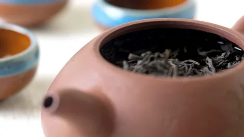 The process of brewing tea in a clay teapot. Tea ceremony. Japan or China Stock Footage 165113440