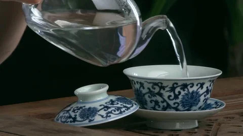 Process brewing tea,tea ceremony,Cup of freshly brewed black tea. Asian tea set Stock Footage