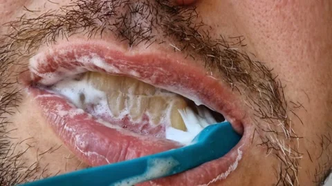 The process of brushing teeth with a brush Stock Footage 346694287