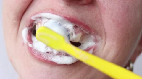 The process of brushing teeth with a toothbrush and toothpaste Stock Footage 346238367