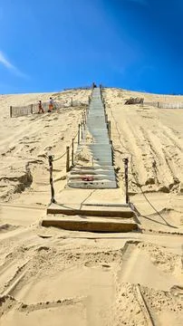 The process of building concrete stairs on the largest European dune of Pilat,or Stock Photos