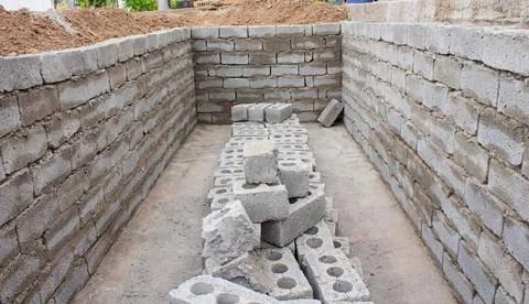 The process of building a home pool for storing water Stock Photos