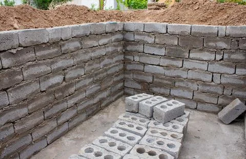 The process of building a home pool for storing water Stock Photos