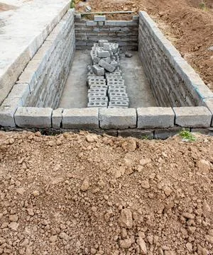 The process of building a home pool for storing water Stock Photos