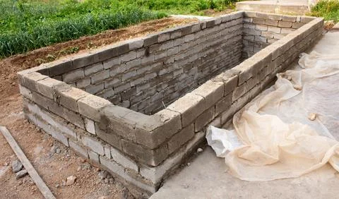 The process of building a home pool for storing water Stock Photos