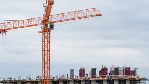 The process of building a monolithic house. Crane and workers 動画素材 169063656