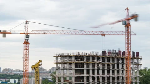 The process of building a monolithic house. Cranes and workers 動画素材 169496714