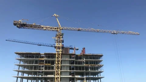 The process of building multi-storey building. Tower crane at construction site Video stock 199094473