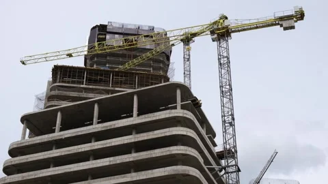 Process of building a multi-storey building at a construction site. Stock Footage 278789529