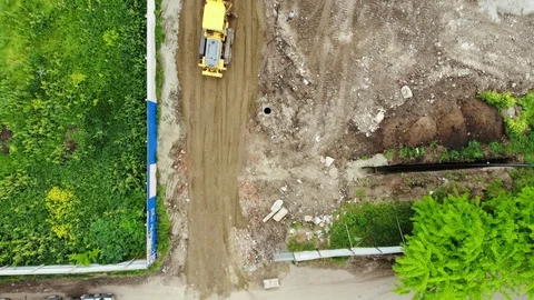 The process of building roads. The tractor aligns the ground. Stock Footage 111527749