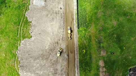 The process of building roads. The tractor aligns the ground. Stock Footage 111529411