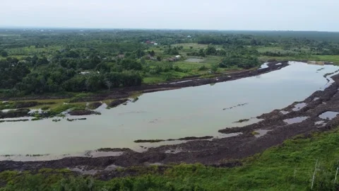 The process of building water irrigation to irrigate plantation areas by di.. Stock Footage 306953695
