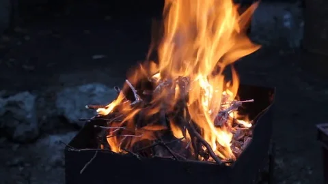 The process of burning a fire in the barbecue in the evening Video stock 76441098