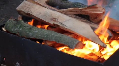 The process of burning a fire in the barbecue in the evening Video stock 76441148
