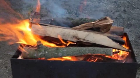 The process of burning a fire in the barbecue in the evening Video stock 76441161