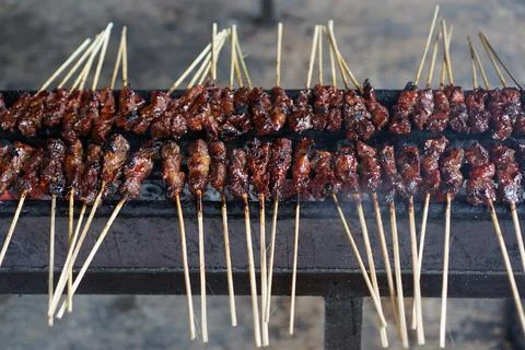 The process of burning Satay on the burning coals. Stock Photos