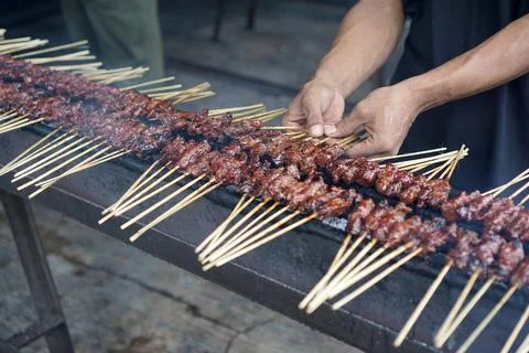The process of burning Satay on the burning coals. Stock Photos