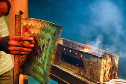 The process of burning savory beef satay with spicy seasoning on the burning Stock Photos