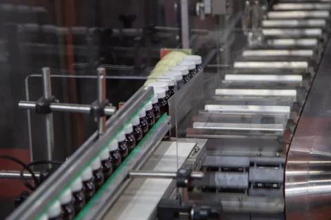 Process of capsule filling and capping machine Stock Photos