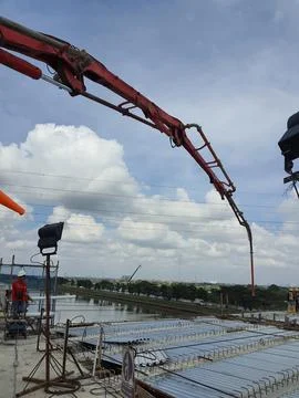 This is a process of casting concrete using a concrete pump to reach casting  Stock Photos