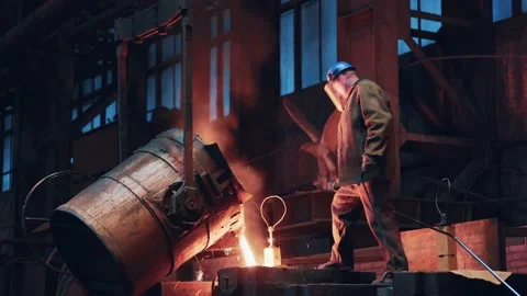 Process of casting molten metal or iron into mold from ladle. Steel foundry Stock Footage 153876537