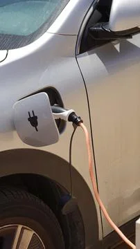 The process of charging an electric car. Rosette close-up Stock-Fotos