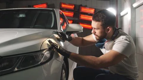 The process of checking the application of nanoceramic coating on a car by a Stock Photos