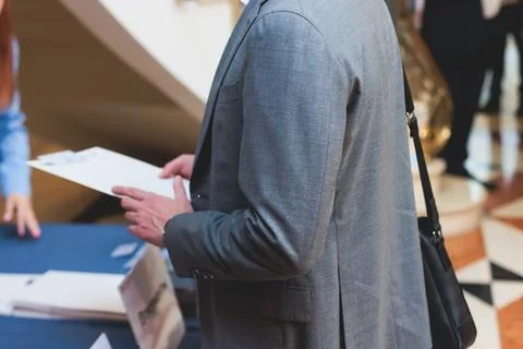 Process of checking in on a conference congress forum event, registration d.. Stock Photos